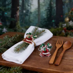 Detailed shot of Christmas bell napkin rings, red green enamel metal tabletop decor.