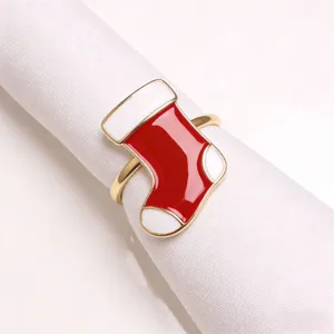 Detailed close-up shot of the Christmas stocking napkin ring with vibrant red and white enamel.