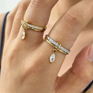 Close up detail shot of double layer stackable ring with sparkling cubic zirconia charms.
