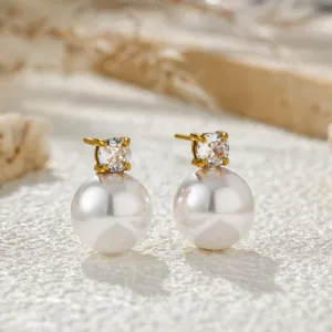 Elegant gold-plated stud earrings featuring a sparkling cubic zirconia and a white pearl.