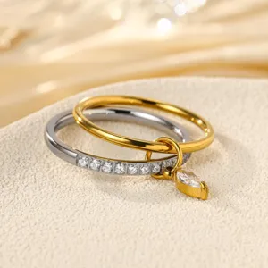 Detail view of double layered stainless steel rings with sparkling cubic zirconia stones.