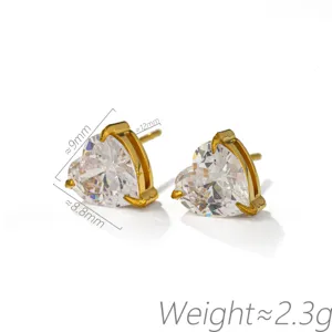 Heart-shaped cubic zirconia stud earrings with gold-toned four-prong setting, sparkle daily.