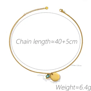 Elegant gold-plated necklace featuring an irregular blue zircon pendant and a round coin charm.