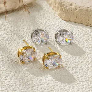 Sparkling round cubic zirconia stud earrings in gold and silver tones with prong setting.