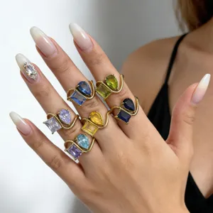 Close-up detail of 18k gold plated multi-color cubic zirconia stackable geometric twin rings.