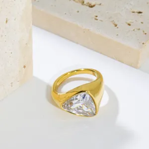 Detail shot of a chunky stainless steel ring featuring a large trillion cut zirconia.