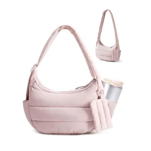 Pink quilted puffer shoulder bag detail, soft down alternative fabric with side pocket.
