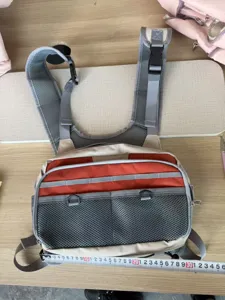 Durable fly fishing chest pack and vest bag for outdoor gear storage, multi-pocket design.