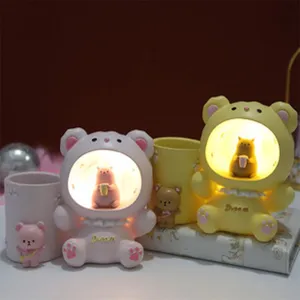 Cute resin bear pen holder night light ornament for girl room desktop decor, warm LED light.