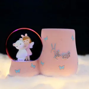 Cute crystal snow globe pen holder night light, pink butterfly resin desk decor for girls room.