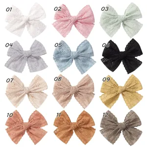 Collection of twelve colorful handmade lace bow hair clips for babies and girls