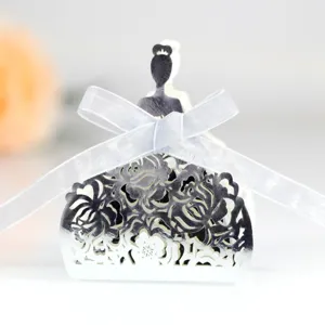 Elegant laser-cut wedding favor candy box with rose pattern and white ribbon bow.