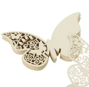 Close-up view of intricate laser-cut 3D butterfly place cards for wedding table settings