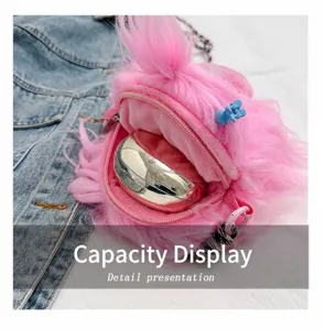 Close-up of pink fuzzy monster plush bag showing interior capacity with a makeup compact.