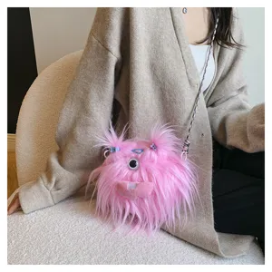 Detailed shot of a cute pink fuzzy monster plush crossbody bag with unique one-eye design
