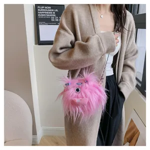 Close-up of a pink furry monster crossbody bag featuring braids and cute doll details