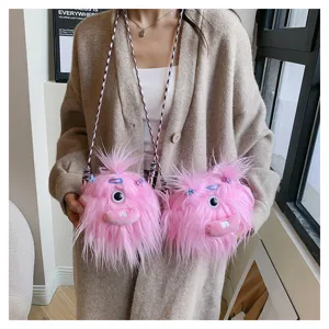 Detailed view of cute pink furry monster plush crossbody bag with single eye and braid