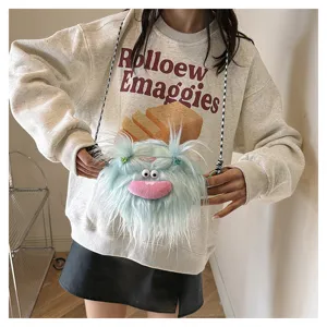 Adorable blue fluffy monster plush crossbody bag with braided pigtails worn by a model.
