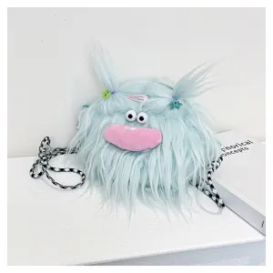 Close-up of a quirky light blue furry monster plush crossbody bag with a pink mouth detail