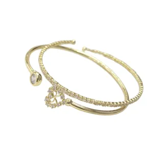 Bracciale rigido aperto dorato con ciondolo quadrifoglio in zircone brillante per donna