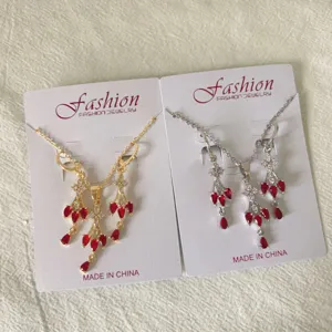 French vintage gold silver cubic zirconia red teardrop tassel necklace earrings set detail view