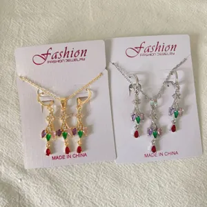 Detail shot of zircon tassel necklace and earrings jewelry set, exquisite craftsmanship.