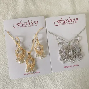 Vintage gold and silver tone crystal zircon tassel necklace earrings jewelry set for women detail.