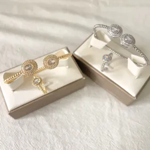 Elegant micro-pave zirconia oval bracelet and ring set, luxury beaded design adjustable.