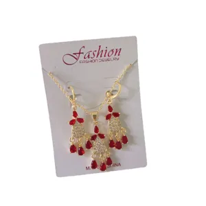 Elegant French vintage gold rhinestone tassel necklace and earrings jewelry set for women.