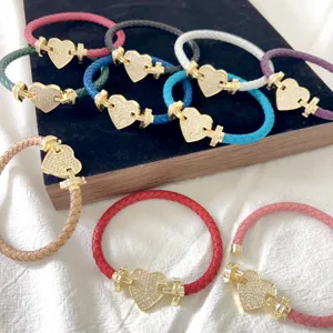 Bracciali in pelle intrecciata colorata con chiusura a cuore in pavé di diamanti eleganti