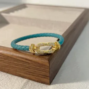 Turquoise braided leather bracelet with gold pave diamond horseshoe buckle for daily wear style