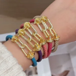 Colorful braided leather U-link bracelet with pavé cubic zirconia detailed charm wristband