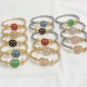 Detailed view of colorful zircon twisted cable bracelets with copper gold finish.
