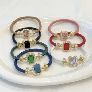 Lusso bracciale in pelle intrecciata con zircone rettangolare e design placcato oro