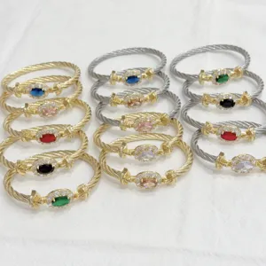 Luxury 18K gold plated cable twist bracelet with colorful oval zircon and pavé crystals.