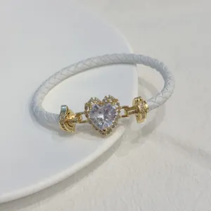 Gold plated white braided leather bracelet with heart zircon charm for stylish daily wear.