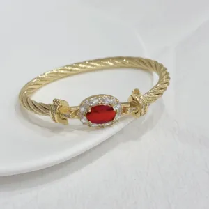 Luxury 18K gold plated twisted cable cuff bracelet featuring oval red cubic zirconia for women