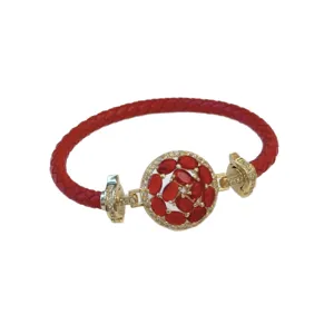 Red braided leather bracelet with gold-plated floral zircon clasp, elegant fashion jewelry.