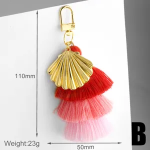 Metal shell tassel keychain with three-layer gradient cotton threads, 110mm total length.
