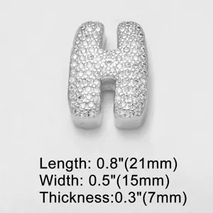 Close-up detail of letter H charm, paved with clear cubic zirconia crystals, silver tone.
