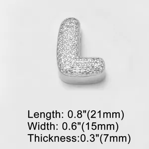 Detail view of silver letter L charm pendant with sparkling cubic zirconia stones, close-up.