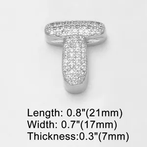 Silver-plated letter T pendant encrusted with sparkling cubic zirconia, detail view.