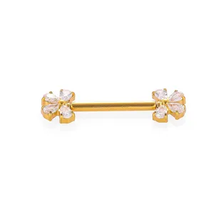 Close up detail of gold body piercing jewelry with sparkling cubic zirconia flower ends.