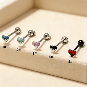 Detailed view of stainless steel heart-shaped tongue bar piercing body jewelry.