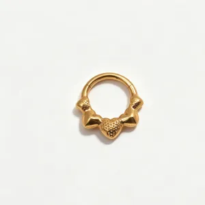 Close-up detail of titanium clicker ring featuring textured heart charms for piercing style.