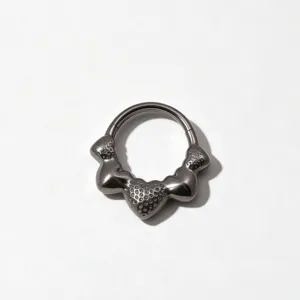 Detailed close-up shot of titanium segment ring featuring unique textured berry design.