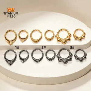 Detailed view of F136 titanium clicker piercing rings in gold and black finishes.