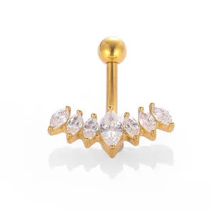 Close-up detail of a gold stainless steel curved belly ring with sparkling cubic zirconia.