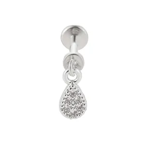 Close-up detail shot of titanium steel labret stud with micro-pave zircon teardrop dangling charm.