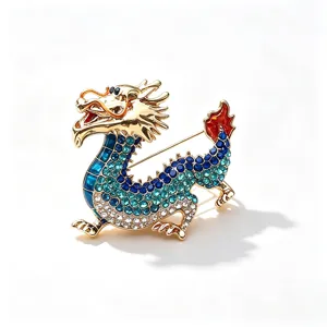 Exquisite gold-tone Chinese dragon brooch pin sparkling with blue and white crystals for suit decor.